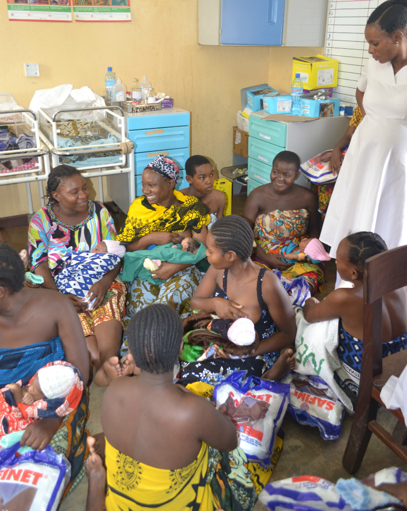 Group of mums feeding babies